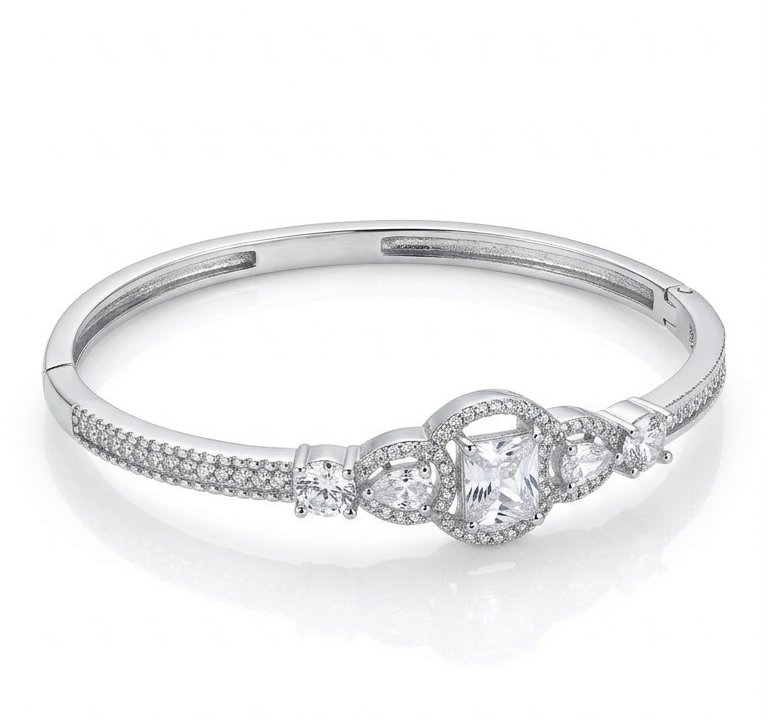 Silver ring with a decorative design on a white background