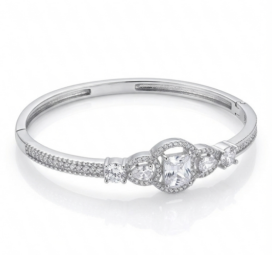 Silver ring with a decorative design on a white background