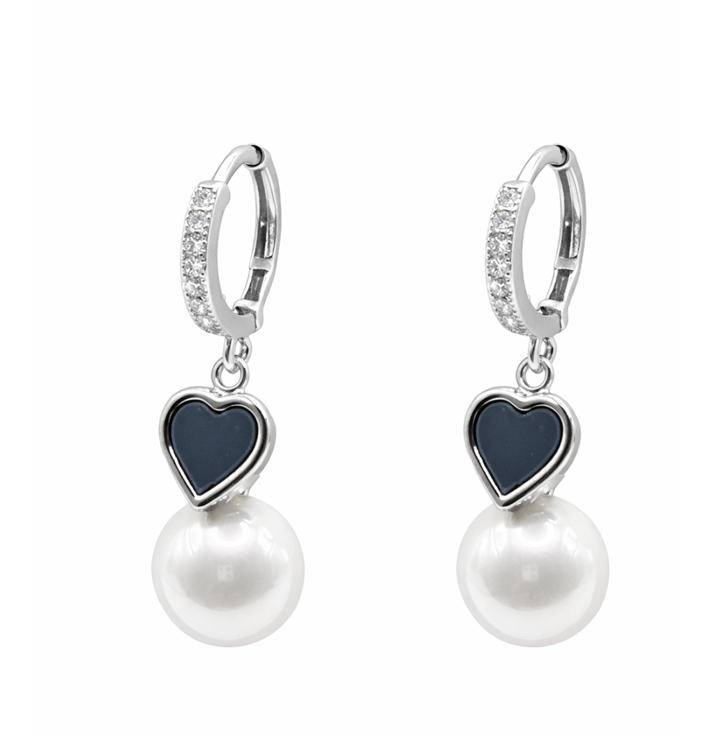 Pair of earrings with heart-shaped dark blue stones and pearl drops on a white background