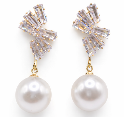 Pearl and crystal drop earrings on a white background
