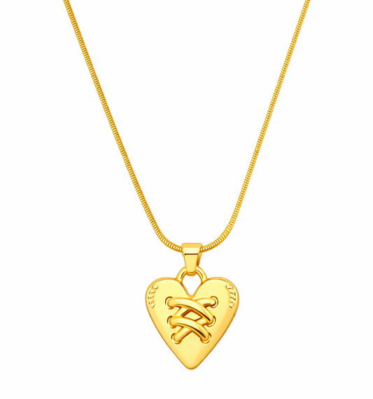 Gold heart-shaped pendant necklace on a white background