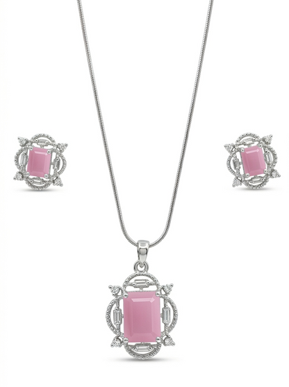 Jewelry set with pink gemstone pendant and earrings on a white background