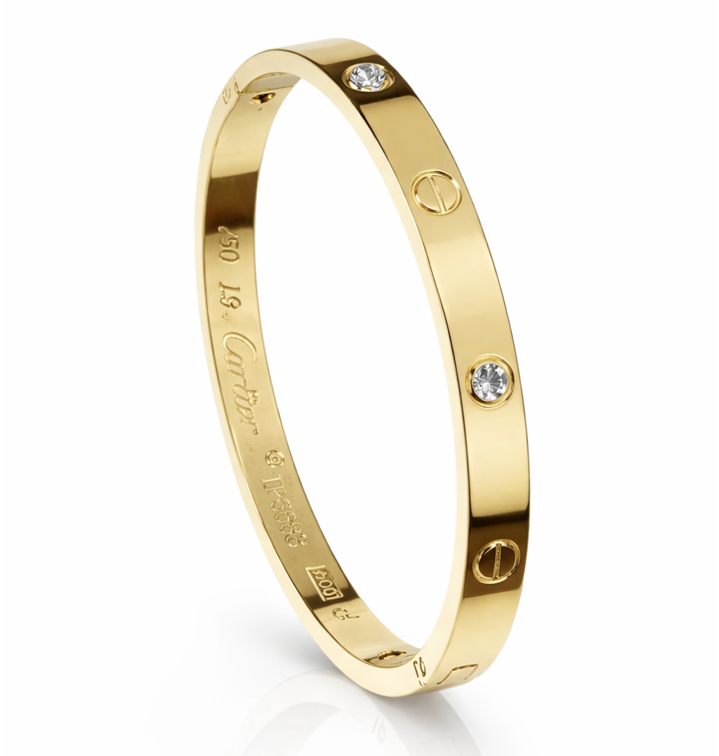 Gold bracelet with diamond accents on a white background