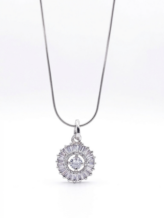 Silver necklace with a round pendant on a white background