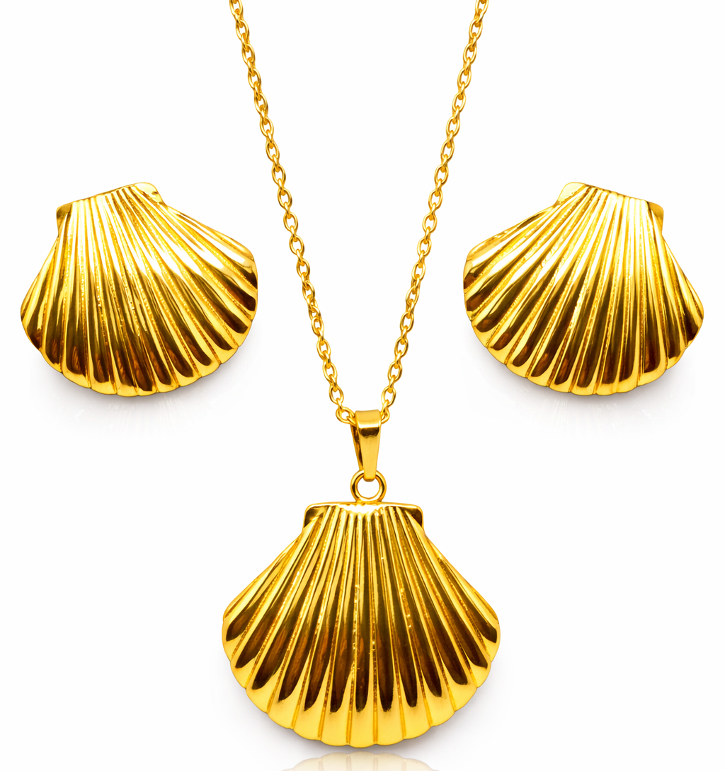 Gold shell pendant necklace and earrings on a white background