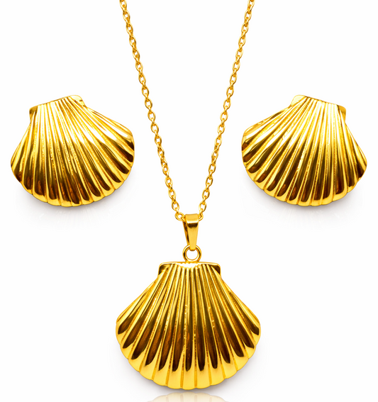 Gold shell pendant necklace and earrings on a white background