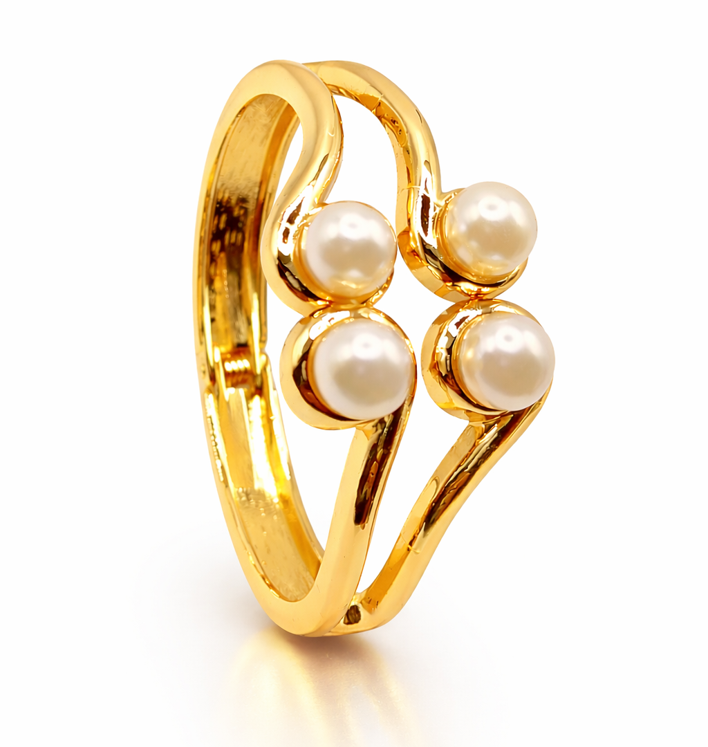 Gold ring with pearls on a white background