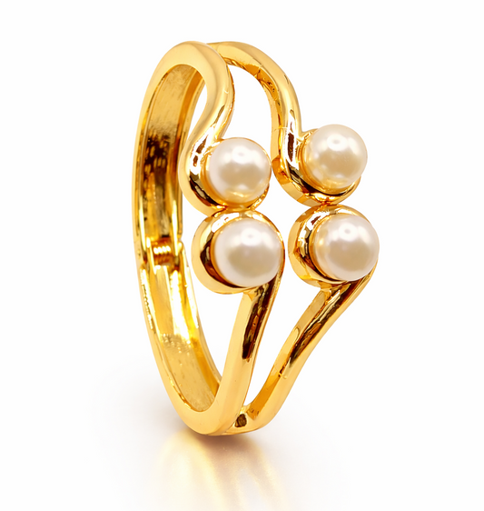 Gold ring with pearls on a white background