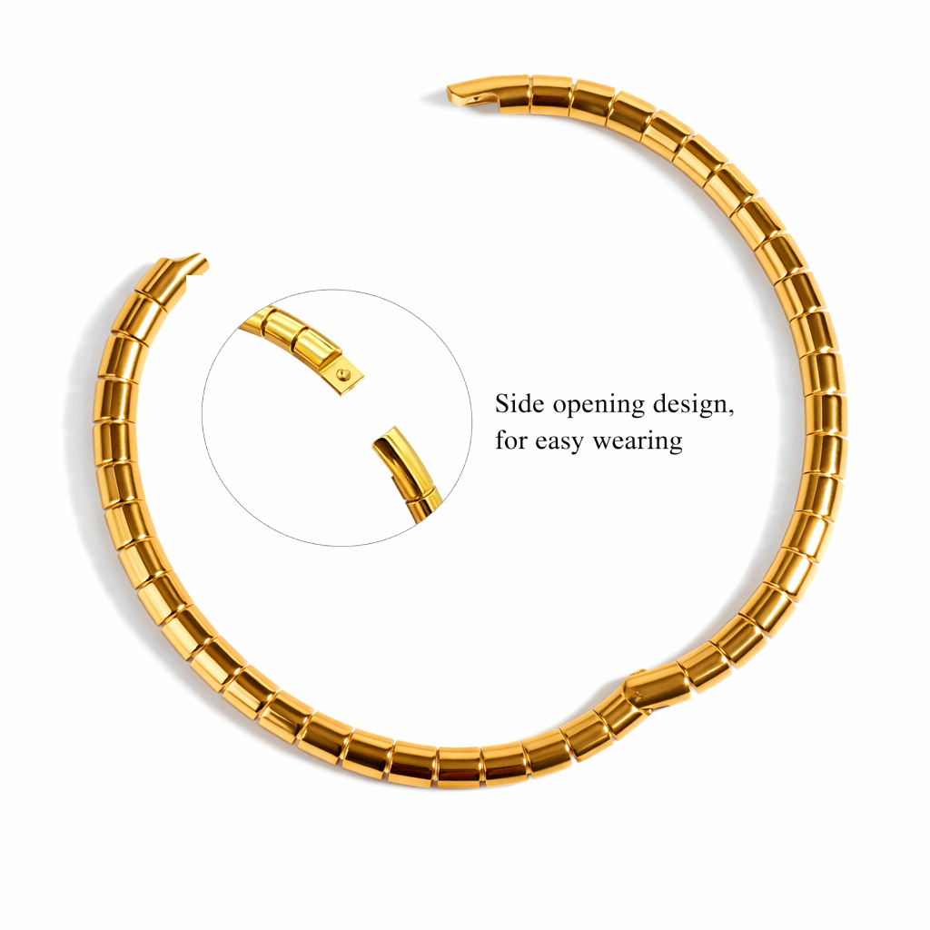Gold bracelet with side opening design on a white background