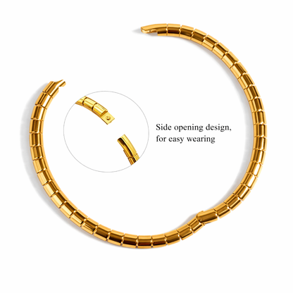 Gold bracelet with side opening design on a white background