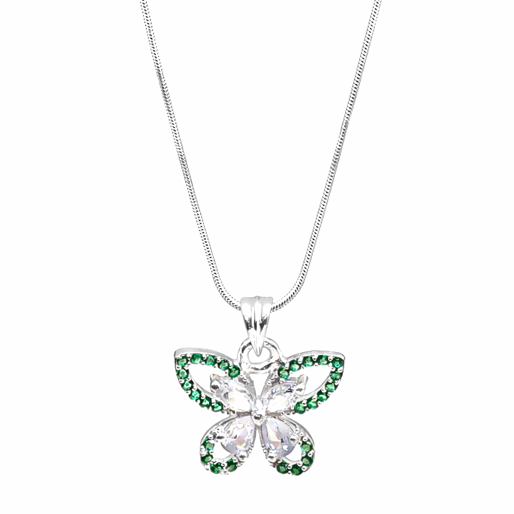 Butterfly-shaped pendant with green gemstones on a white background