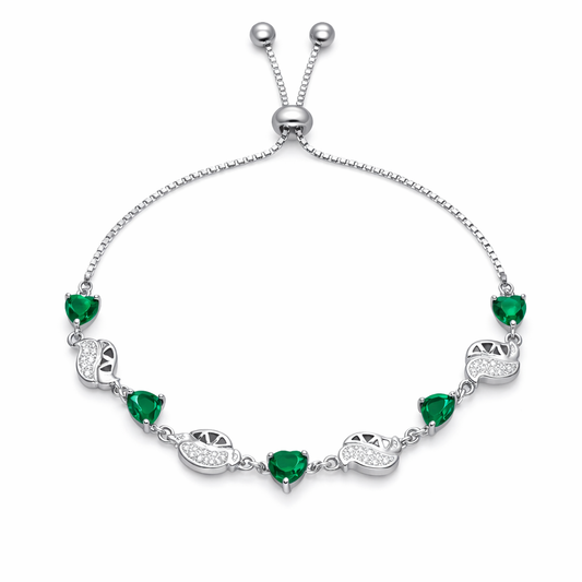 Silver bracelet with green gemstones on a white background