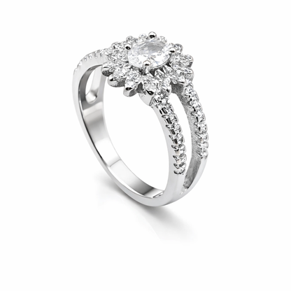 Silver ring with a diamond cluster on a white background