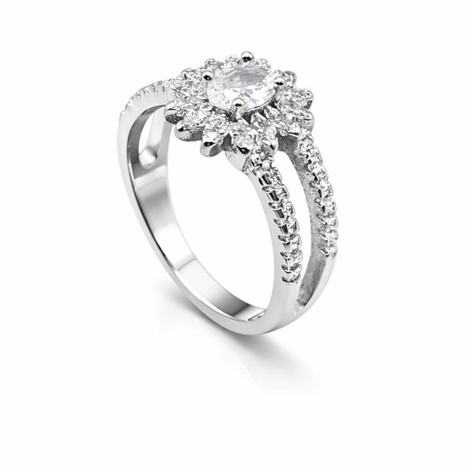 Silver ring with a diamond cluster on a white background