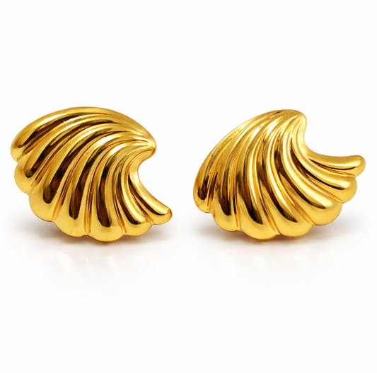 Pair of gold earrings on a white background